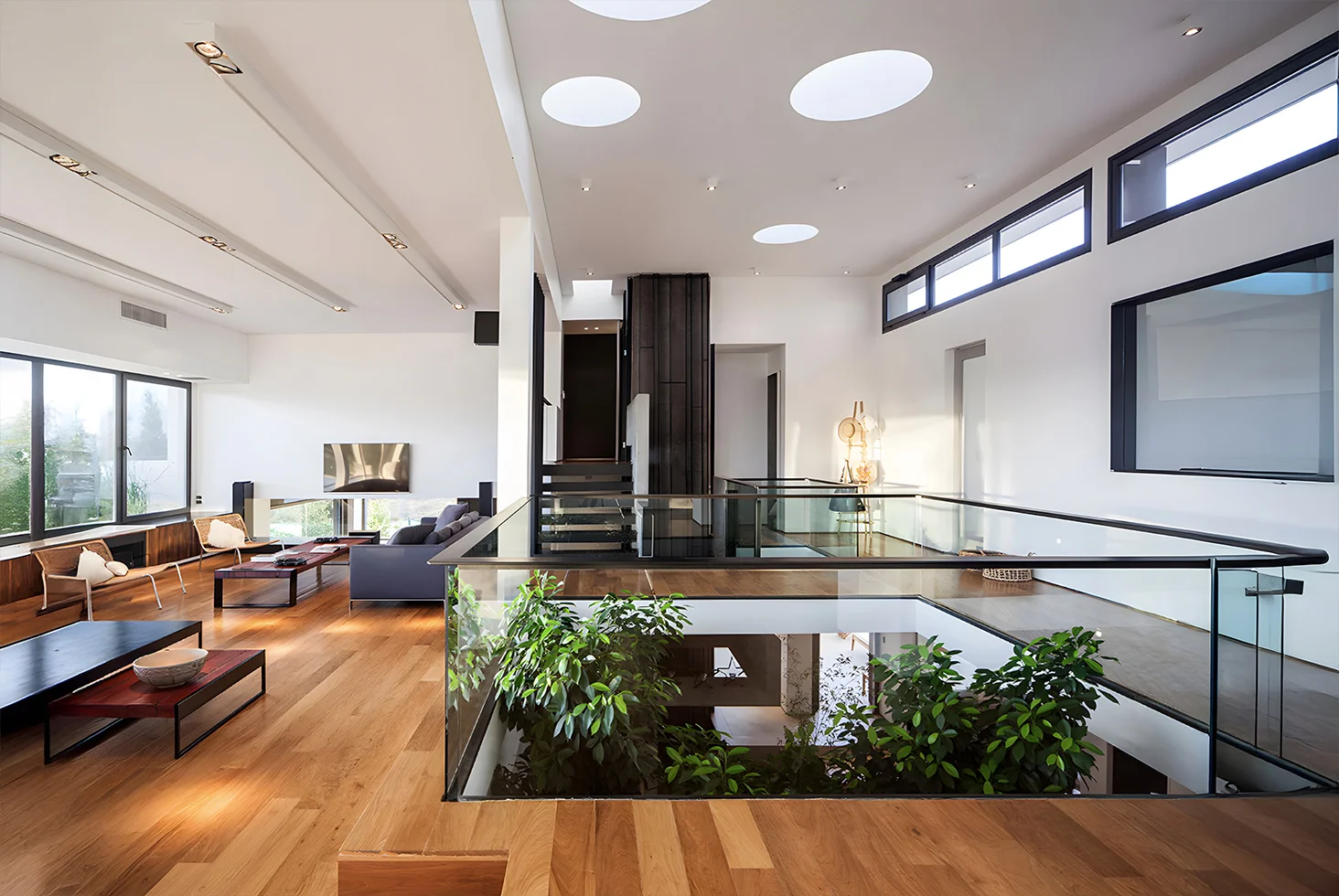 Casa Rampa residential interior with glass railing.