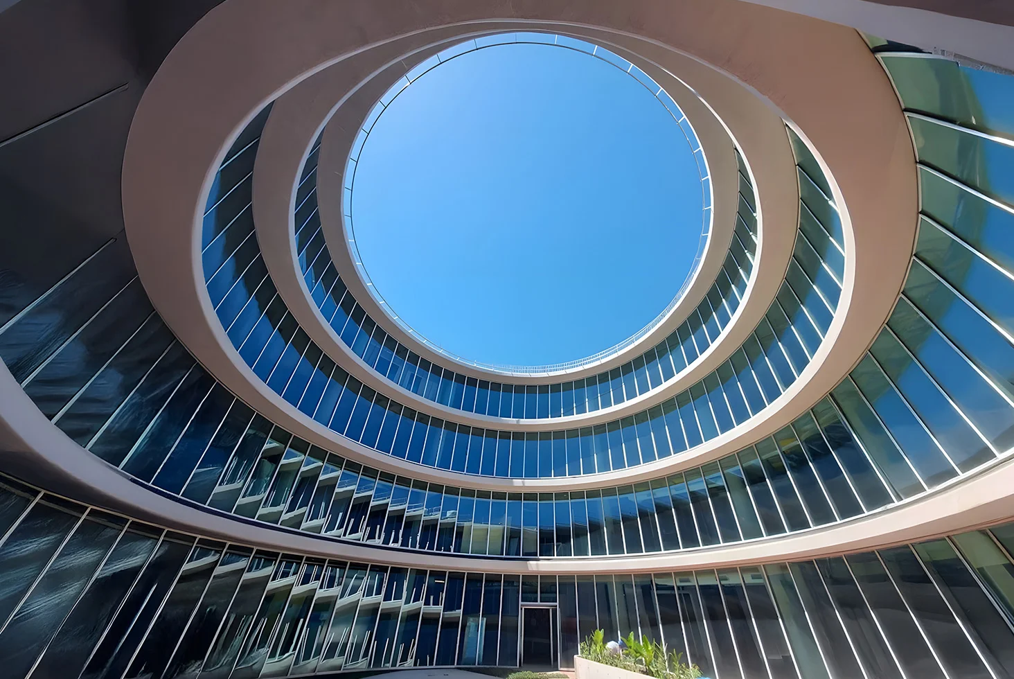 Interior circular courtyard with glass façade at Google Offices Buenos Aires.