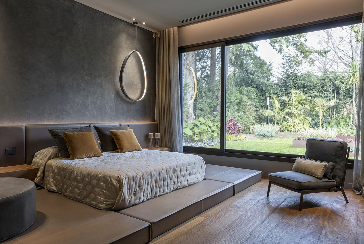 Highland Park residential bedroom with large window and garden view.
